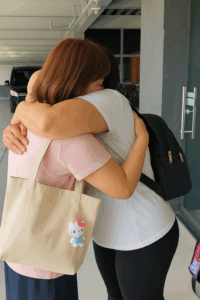 warm embrace in a parking garage